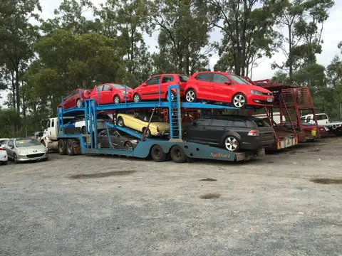 Auto Mover Multi-Level Car Carrier with Red Vehicles