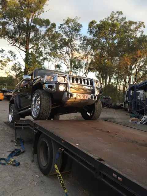 Auto Mover Black Hummer H3 Secured on Flatbed Trailer