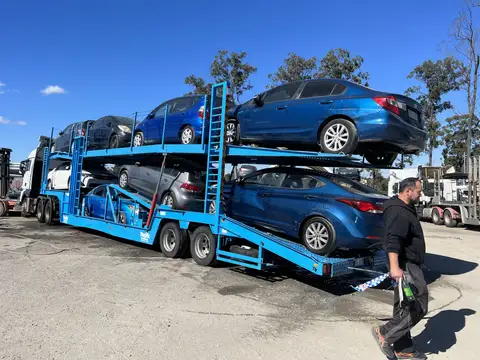 Auto Mover Blue Car Carrier Loaded with Multiple Vehicles