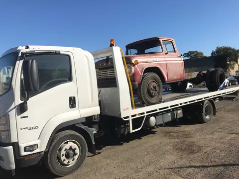 Auto Mover Isuzu Truck Transporting Vintage Ford Pickup