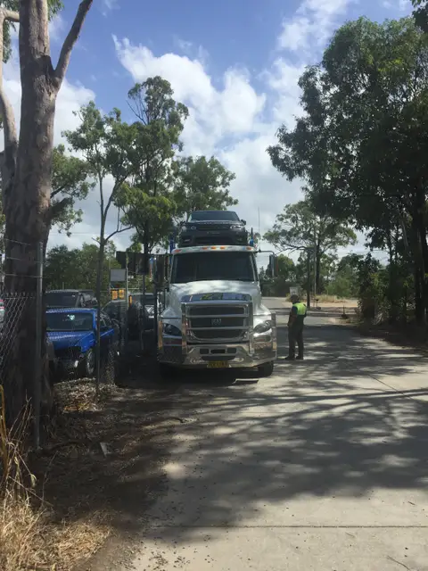 Auto Mover Transporting Dark Range Rover on Heavy Carrier