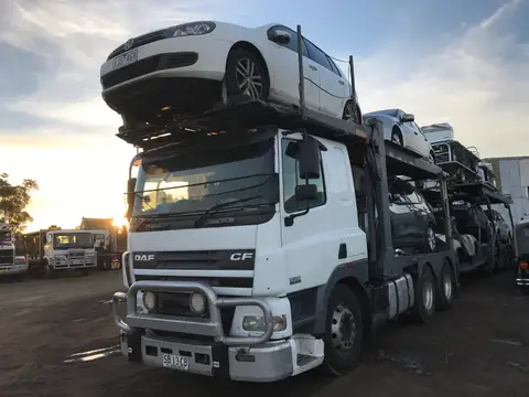 Auto Mover White Sedan Loaded on Car Carrier Truck
